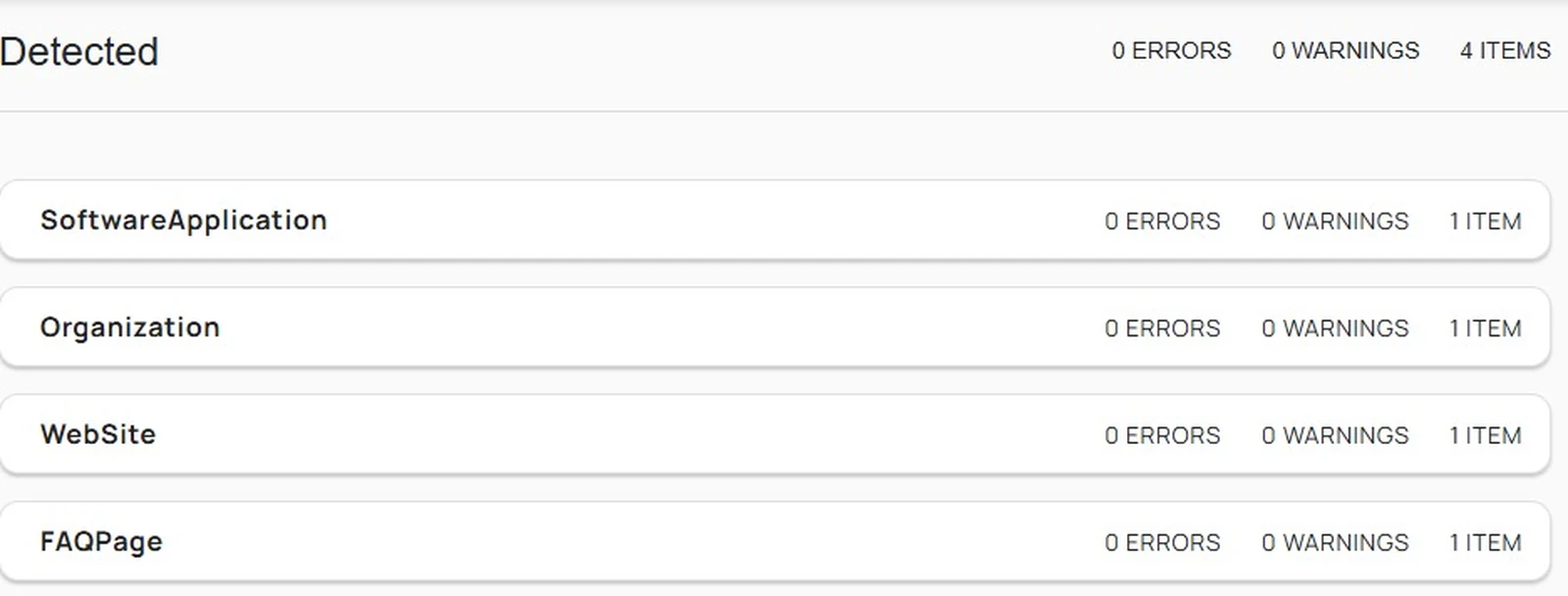 Schema.org validator results showing four detected types, SoftwareApplication, Organization, WebSite and FAQPage, each with zero errors and zero warnings.
